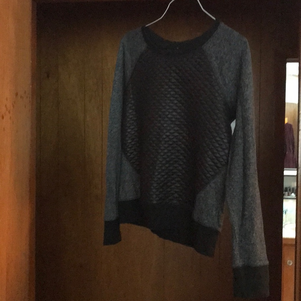 Black leather and grey sweater